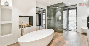Modern bathroom with freestanding tub, walk-in shower, and built-in fireplace.